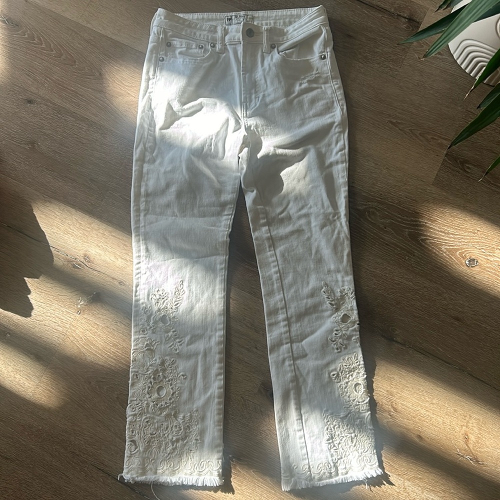 Free people white lace bottom jeans.